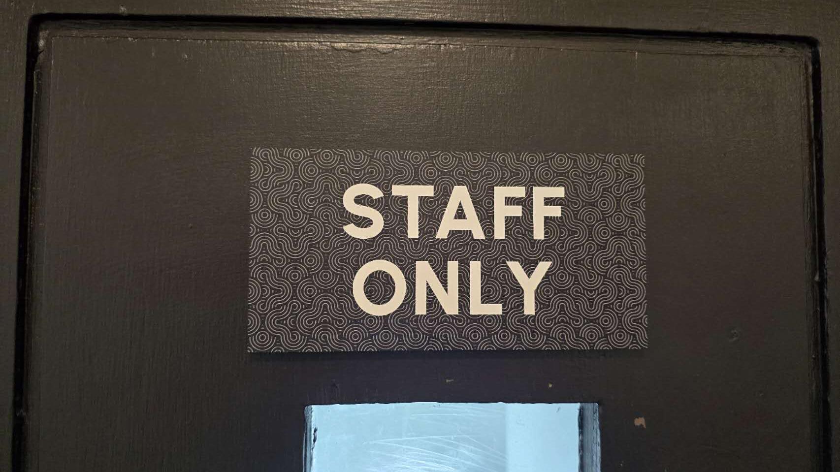 A sign reading STAFF ONLY on a door